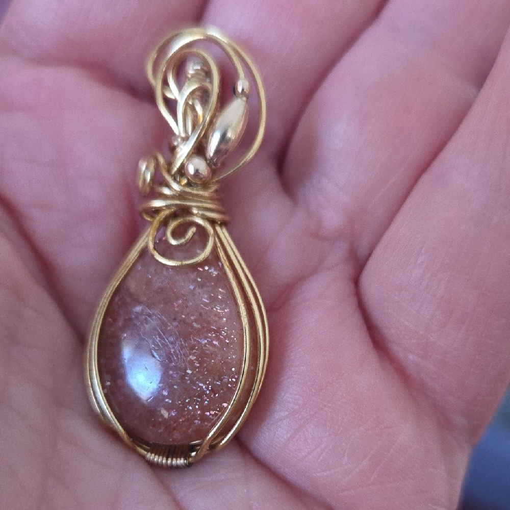 Sparkling Sunstone Pendant Wrapped In Brass